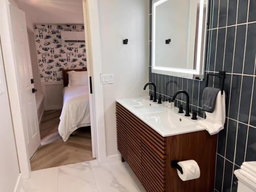 a bathroom with a sink and a mirror at Chalet 239-Boutique Hotel in West Dover