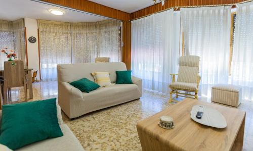 a living room with a couch and a table at Balcón de la tejera in Cazorla