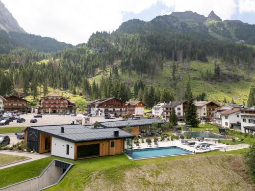 an aerial view of a resort in the mountains at Hotel Majon Miramonti in Canazei