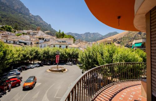 a view of a town with cars parked in a parking lot at Balcón de la tejera in Cazorla