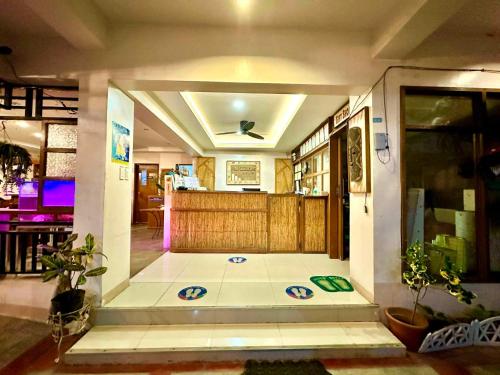 a room with a lobby with a door and a floor at Papierus Pensionne in Kalibo