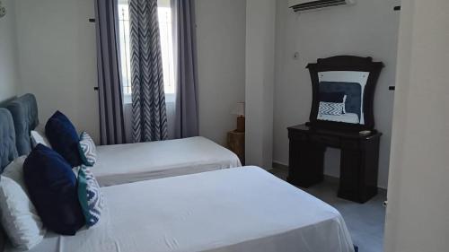 Postel nebo postele na pokoji v ubytování Grand Baie View Appart