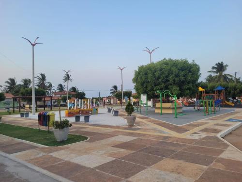 a park with a playground with slides and swings at The Jungle, Village & Beach in Guriú
