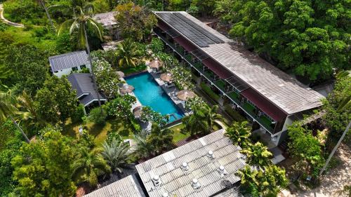 an aerial view of a resort with a swimming pool at The Nidhra Boutique Resort in Baan Tai