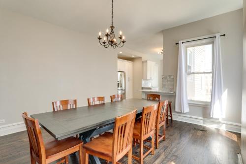 a dining room with a table and chairs at Spacious Chicago Condo with Deck Less Than 9 Mi to Downtown! in Oak Park