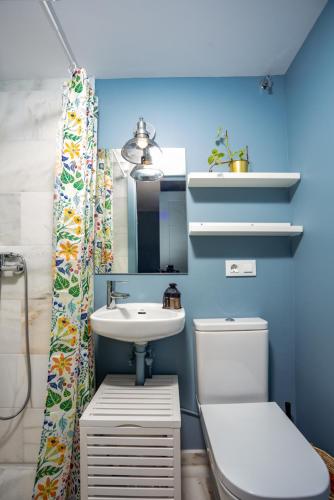 a bathroom with a sink and a toilet at TrendyHomes Neptuno Mojacar in Mojácar