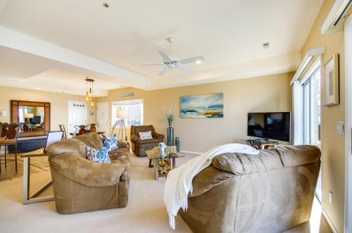 a living room with two couches and a tv at Pool Access, Water Views Lake Ozark Condo! in Lake Ozark