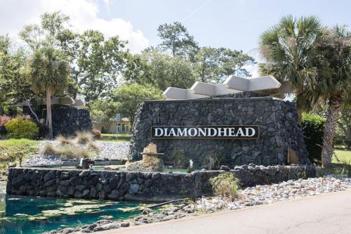 a sign at the entrance to aldwardheadzoszos at 18th Hole Hideaway in Diamondhead