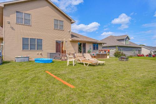 a yard with chairs and a frisbee in front of a house at Family-Friendly Unit 8 Mi to Appleton Downtown! in Appleton