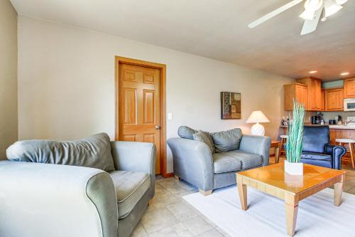 a living room with two couches and a table at Family-Friendly Unit 8 Mi to Appleton Downtown! in Appleton
