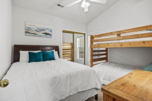 a bedroom with two beds with blue pillows at 40 Lighthouse Rd. Unit 3-402 in Lake Ozark