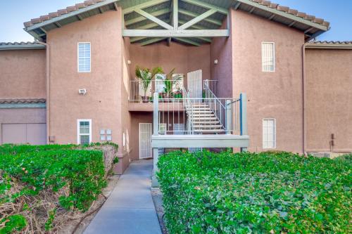 a building with stairs and a balcony with plants at Sunny San Diego Condo with Pool Access Near Wineries in San Diego