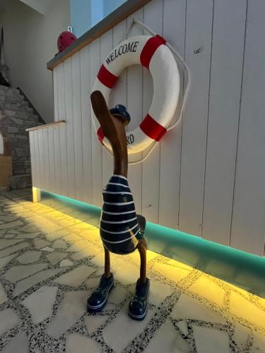 a plastic figurine of a man holding a lifesaver at Hostal Barco da Vella in Merejo