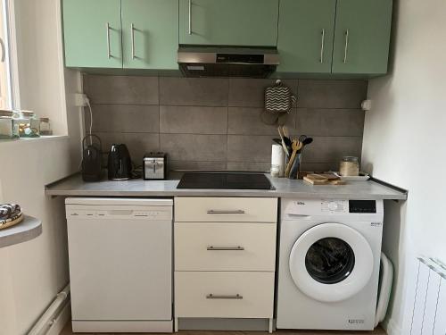 Kuchyň nebo kuchyňský kout v ubytování Guimbert'Home