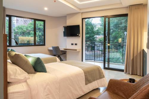 TV a/nebo společenská místnost v ubytování Hotel Living 35 Suites