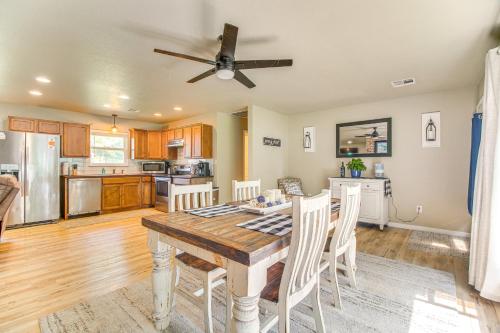 a kitchen and dining room with a table and chairs at On-Site Lake Access Pet-Friendly Vinita Home in Disney