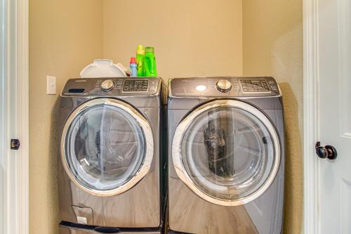 two washing machines sitting next to each other in a room at On-Site Lake Access Pet-Friendly Vinita Home in Disney