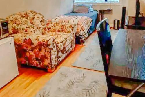 a living room with a couch and a bed at The Enchanted Cheetah in Minneapolis
