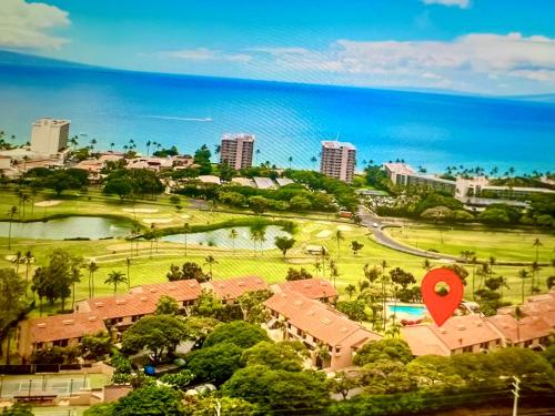 an aerial view of a resort with a red target at Kaanapali's Royal Luxury Plantation Beach & Golf Retreat in Kaanapali