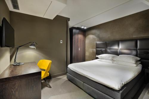 Posteľ alebo postele v izbe v ubytovaní Amsterdam Forest Hotel