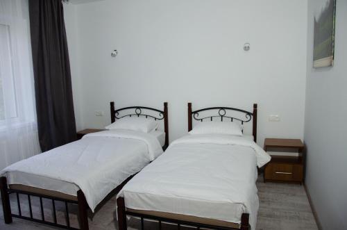 Ein Bett oder Betten in einem Zimmer der Unterkunft D&T Hotel