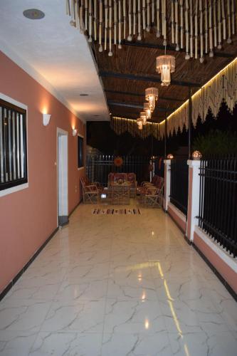 a lobby with a table and chairs and chandeliers at Karma Kono in Abu Simbel
