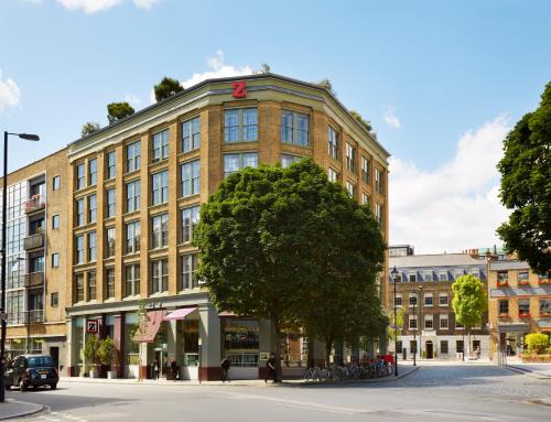 a large brick building with a tree in front of it at The Zetter Hotel in London