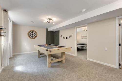 a room with a pool table and a bedroom at Downtown Windsor Home with Hot Tub and Pool Table in Windsor