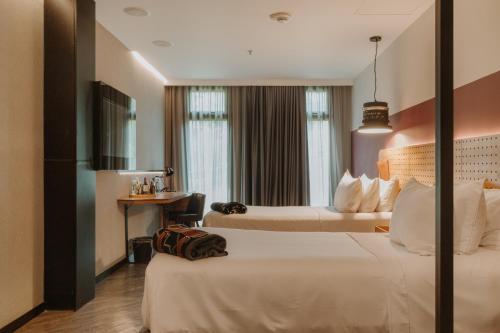 Postel nebo postele na pokoji v ubytování The Click Clack Hotel Medellín