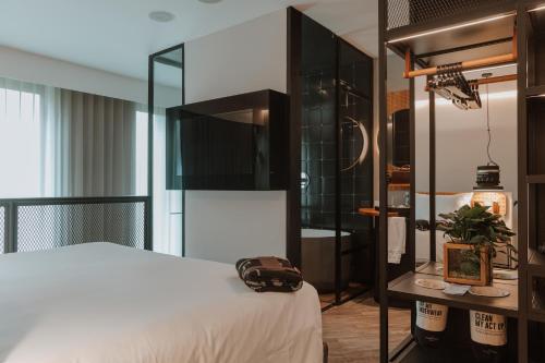 Postel nebo postele na pokoji v ubytování The Click Clack Hotel Medellín