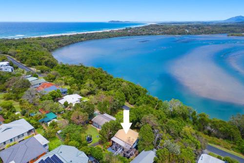 an aerial view of a house next to a body of water at Seascape in North Haven