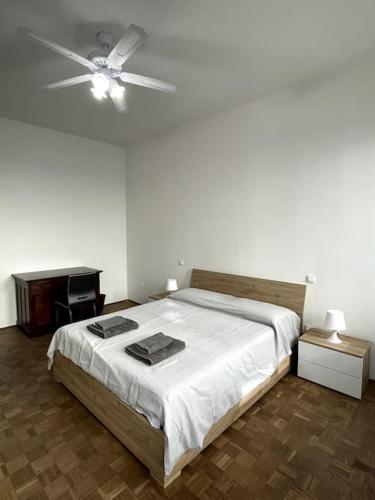 a bedroom with a bed and a ceiling fan at Arte in Mantova in Mantova