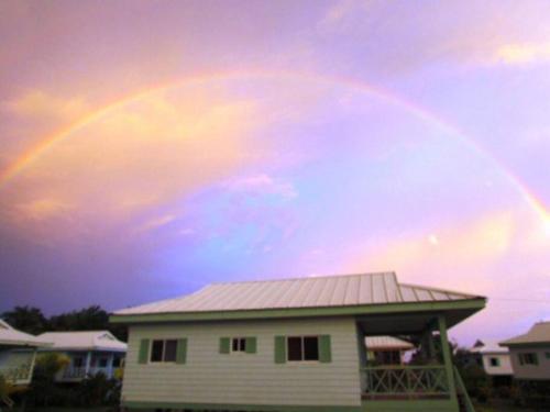 a rainbow in the sky over a house at #17A Hermosa Beach Bungalow 1st floor 1 bedroom Apt in Playa Hermosa