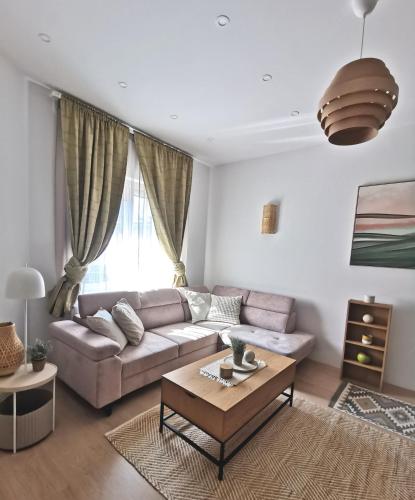 a living room with a couch and a table at Apartment Krisz in Budapest