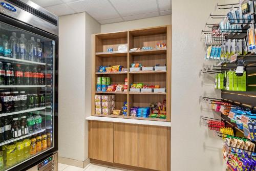a store aisle with shelves of food and drinks at Best Western Limon in Limon
