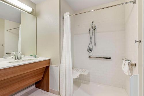 a bathroom with a sink and a toilet and a shower at Best Western Limon in Limon