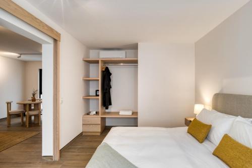 a bedroom with a white bed and a desk at TONALA By Mr W in Mexico City