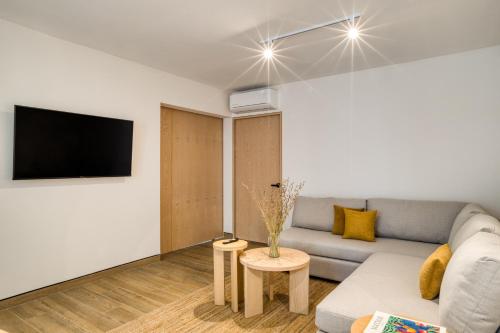 a living room with a couch and a tv at TONALA By Mr W in Mexico City