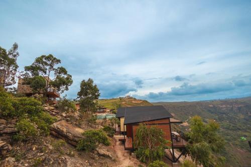 a small house on a hill with a view at Hotel Aborígenes in Los Santos
