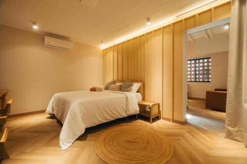 Postel nebo postele na pokoji v ubytování Hotel Boutique Roomzz Laureles