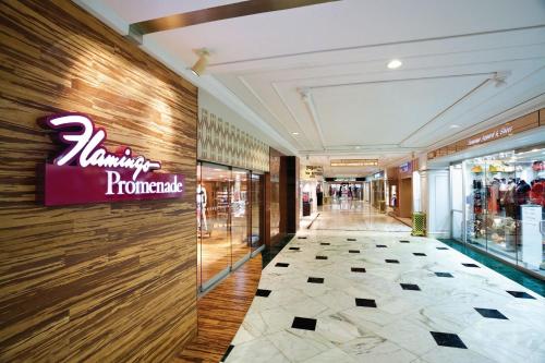 a shopping mall hallway with a sign on the wall at Flamingo Las Vegas Hotel & Casino in Las Vegas