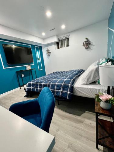 a bedroom with a bed and a tv on the wall at Private Room Near Airport K7 in Mississauga