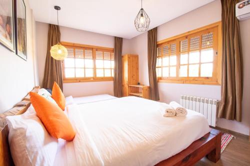 Postel nebo postele na pokoji v ubytování Bio et Bois -Luxury Bio Farm-
