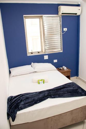 Postel nebo postele na pokoji v ubytování Tripoli Sorocaba Hotel