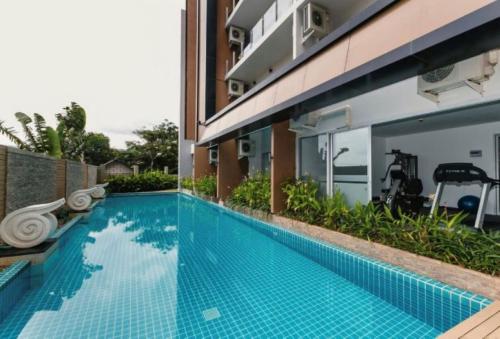 a swimming pool in front of a building at Апартаменты с видом на море на Карон Бич А 509 in Karon Beach