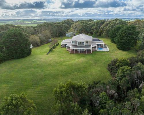an aerial view of a house on a large green field at Waterview Inverloch in Inverloch