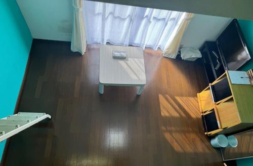 an overhead view of a room with a table and a bed at Real Corp 102 - Vacation STAY 10915v in Chiba