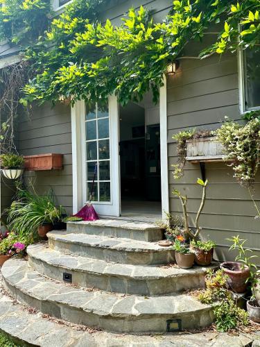 a house with stairs leading to a door at Oasis Hollywood in Los Angeles