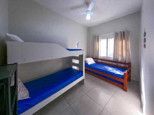 Ένα ή περισσότερα κρεβάτια σε δωμάτιο στο Aconchego e Descanso na PG