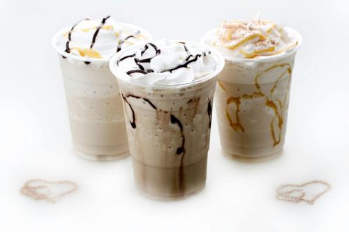 a group of three cups of coffee with whipped cream at Aswar Hotel Suites in Riyadh